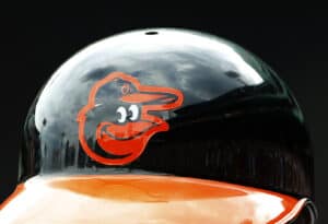BOSTON, MA - JUNE 25: The Baltimore Orioles logo is seen on a batting helmet during the game between the Boston Red Sox and the Baltimore Orioles at Fenway Park on June 25, 2015 in Boston, Massachusetts.